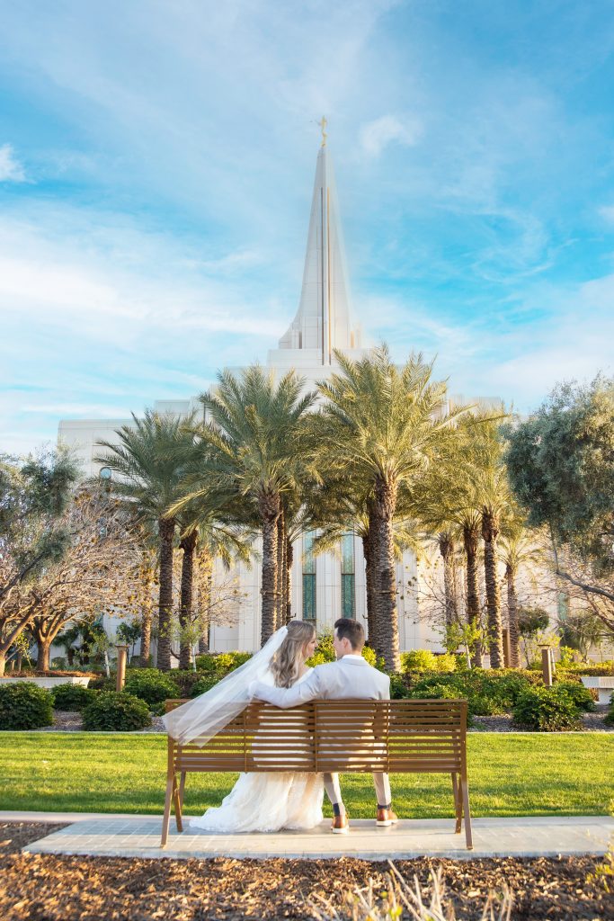 Blue sky with clouds with bride and groom at the Gilbert Temple
