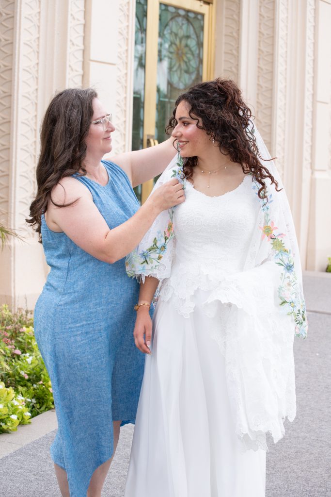 Bride and mom at the Gilbert Arizona Temple getting ready for photos