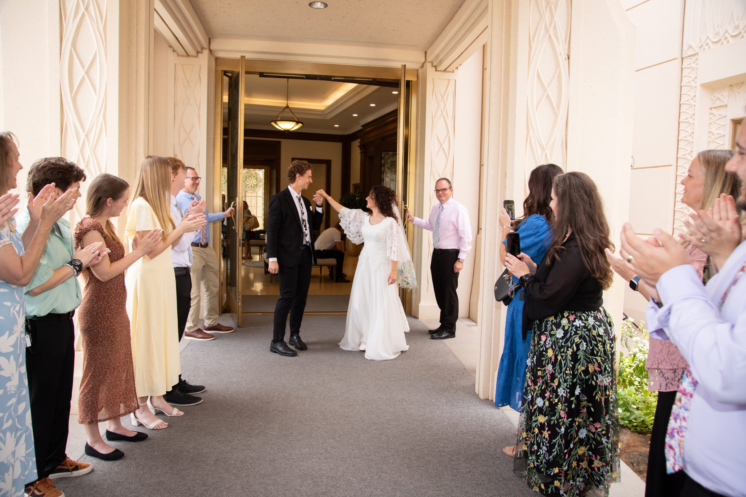 Bride and groom Walking at the Gilbert Temple