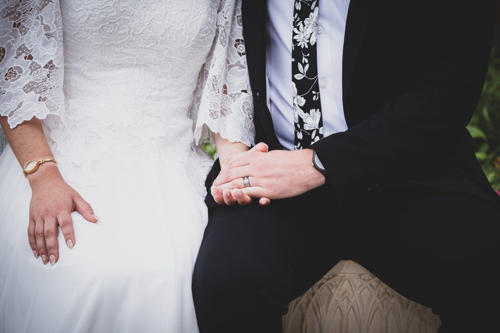 Bride and groom holding hands Gilbert Arizona Temple